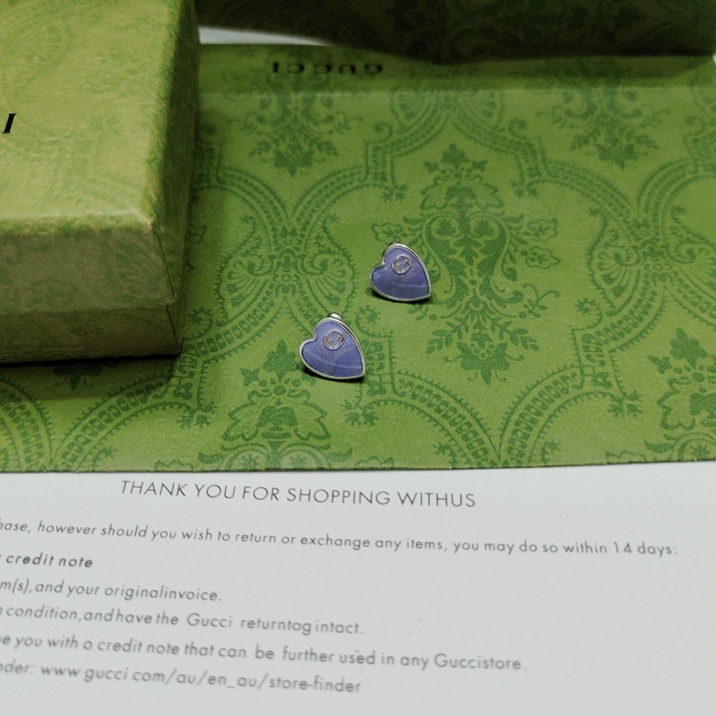 G*u*i earrings